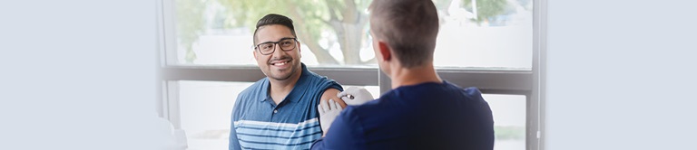 Man receiving a vaccine.