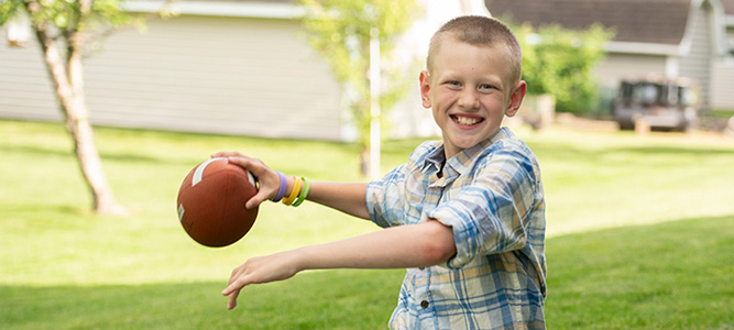 Will Krause throwing a football
