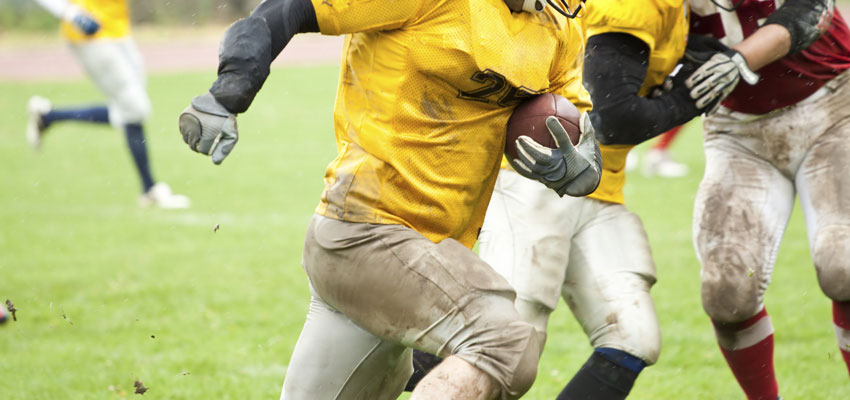football player carrying football