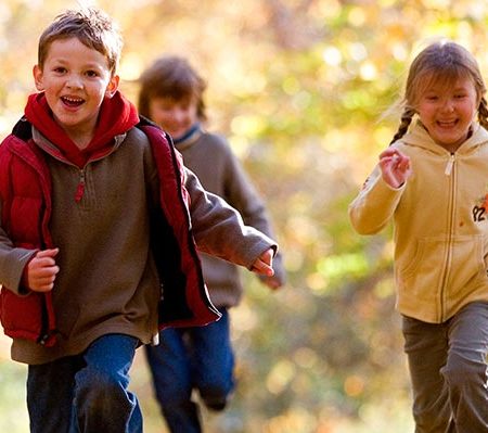 Kids running in a park