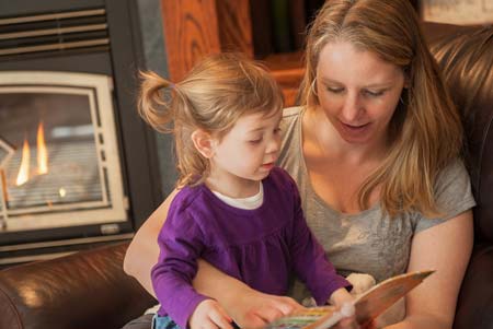 Mom reading to daughter