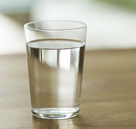 Glass of water on table