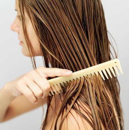 Woman combing her hair