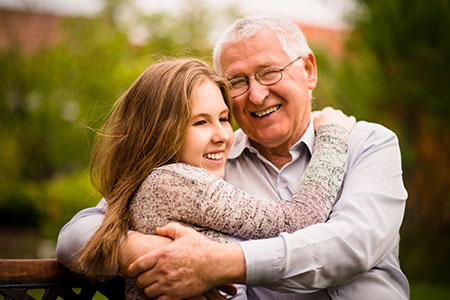 Granddaughter hugging her grandfather - Is DNA destiny?