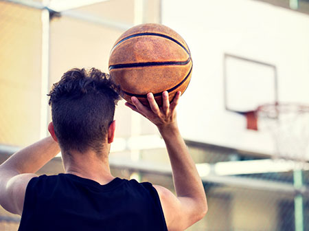 Basketball player working on shooting form - Shoulder instability management in young athletes