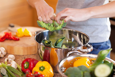 Woman prepping vegetables - Whole foods eating