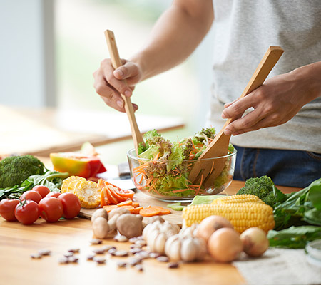 Person tossing a salad