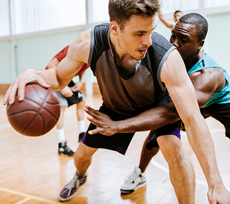 Middle-aged men playing basketball - New exercise program precautions