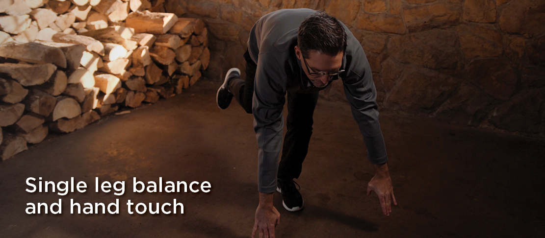 single leg balance and hand touch warmup before exercise