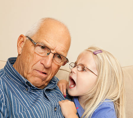 Granddaughter yelling into grandfather's ear - Chemotherapy-related hearing problems