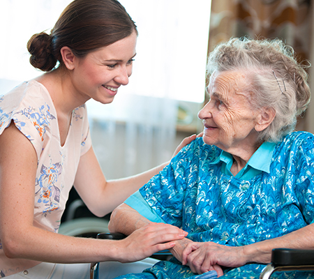 Young woman and senior woman talking to each other - Choosing a nursing home