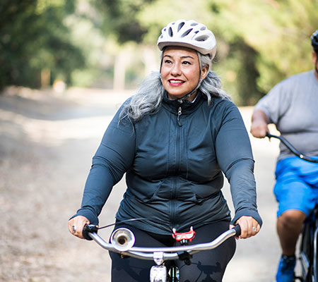 woman riding a bicycle with a friend / heart general overview blog article