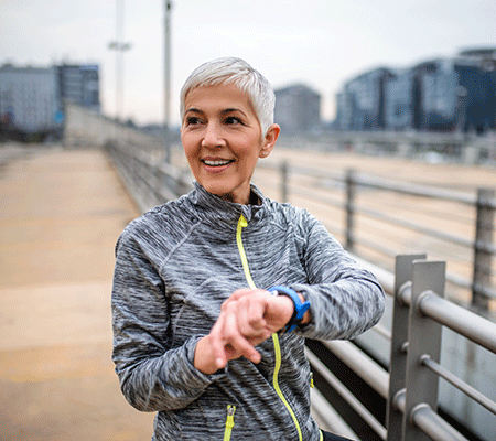 Woman timing her run - Ejection fraction