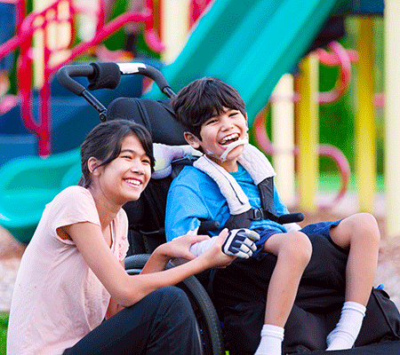 Brother with special needs with his sister at the park - Siblings of children with special needs