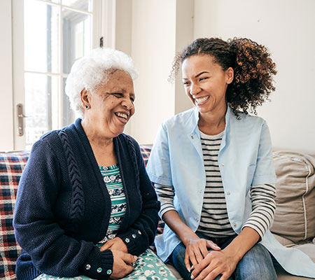 Grandmother and granddaughter talking - Do concussions cause dementia?