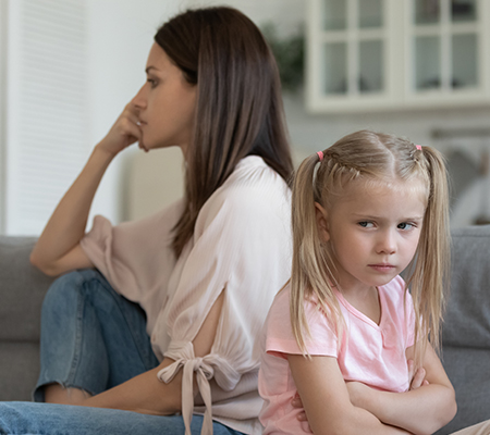 Woman and child ignoring each other after a spanking incident