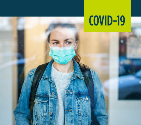 A woman prepares to go outside.