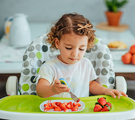 child eating food within dietary guidelines for a healthy life
