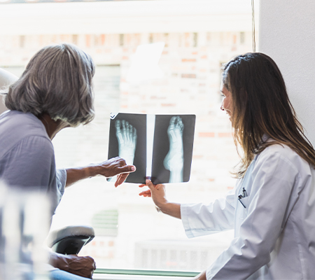 Podiatrist talks about foot health with patient