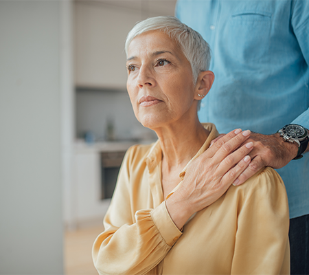woman with history of stroke being counseled by husband