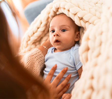 Picture of baby under a blanket