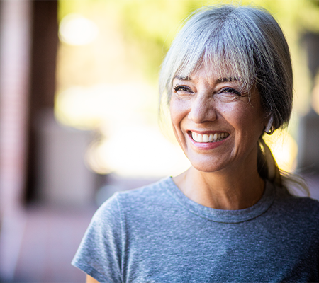 Middle-aged woman smiling in summer