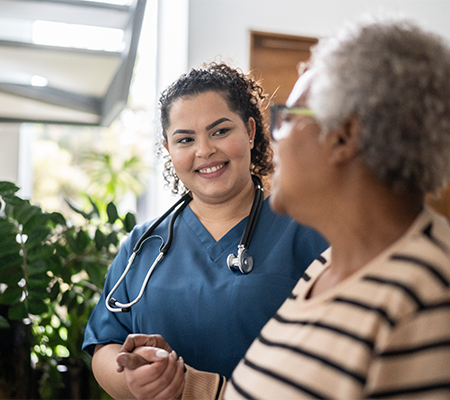 oncology nurse navigator comforting a patient