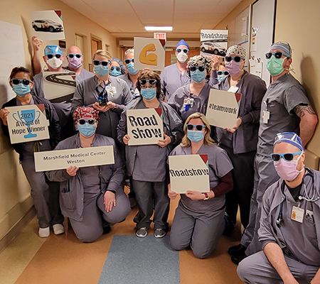 Health care staff standing for photo celebrating the organ and tissue donation award