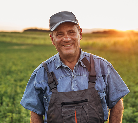farmer in field contemplating mental health