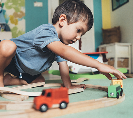 Child with urologic conditions playing with toys