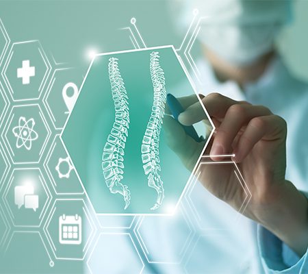 Provider pointing to spine image, discussing back pain relief options