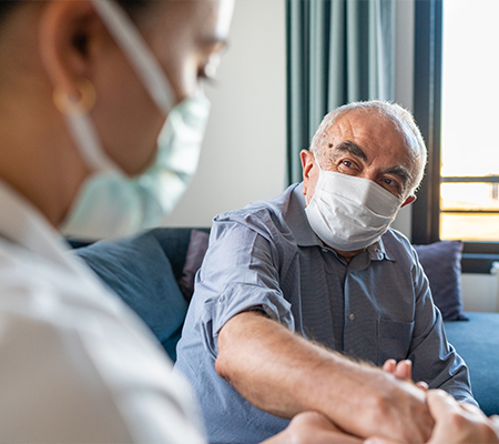 Doctor examines man with neuropathic pain symptoms