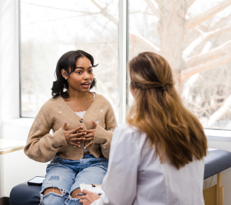 woman discussing MIGS with OB/GYN